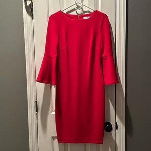 Comfortable and stylish dress—flared sleeves and eye catching back gold zipper.